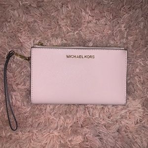 Pink Michael Kors wristlet wallet